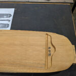 Top, bridge area of the guqin after rough shaping has been done.
