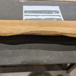 Close-up of the side of the guqin after rough shaping has been done.