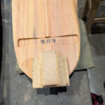 Hardwood block inset to be carved into a tuning peg protector.