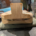 Rear view of the hardwood block inset to be carved into a tuning peg protector.
