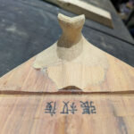 Front view of the tuning peg protector after carving is complete.
