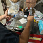Powdered deer antler being measured to mix with lacquer.