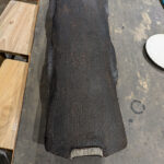 Top view of cotton mesh fabric embedded in lacquer cement for added strength.